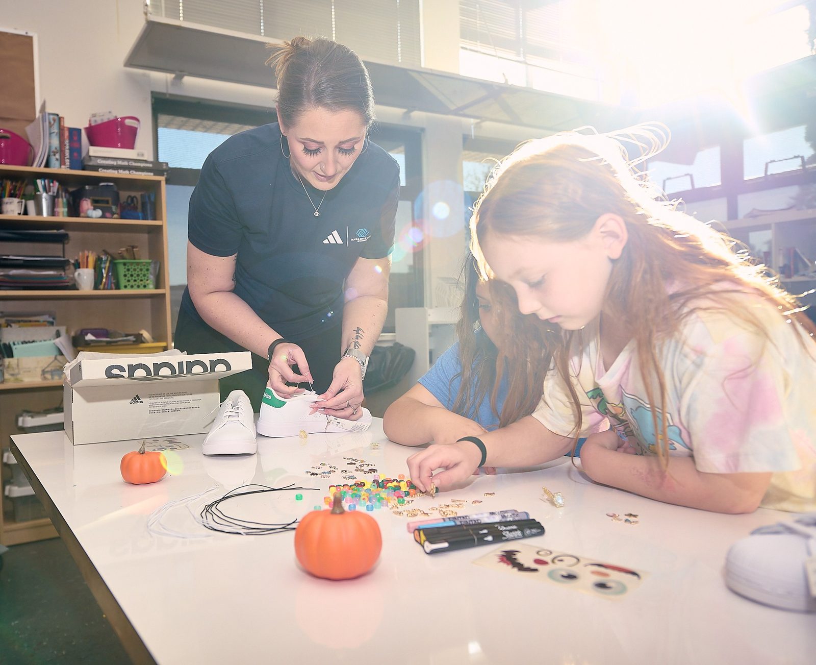 Young people at work with a GMS team member